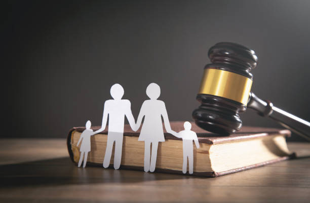 Paper cut family, judge gavel and book. Family Law